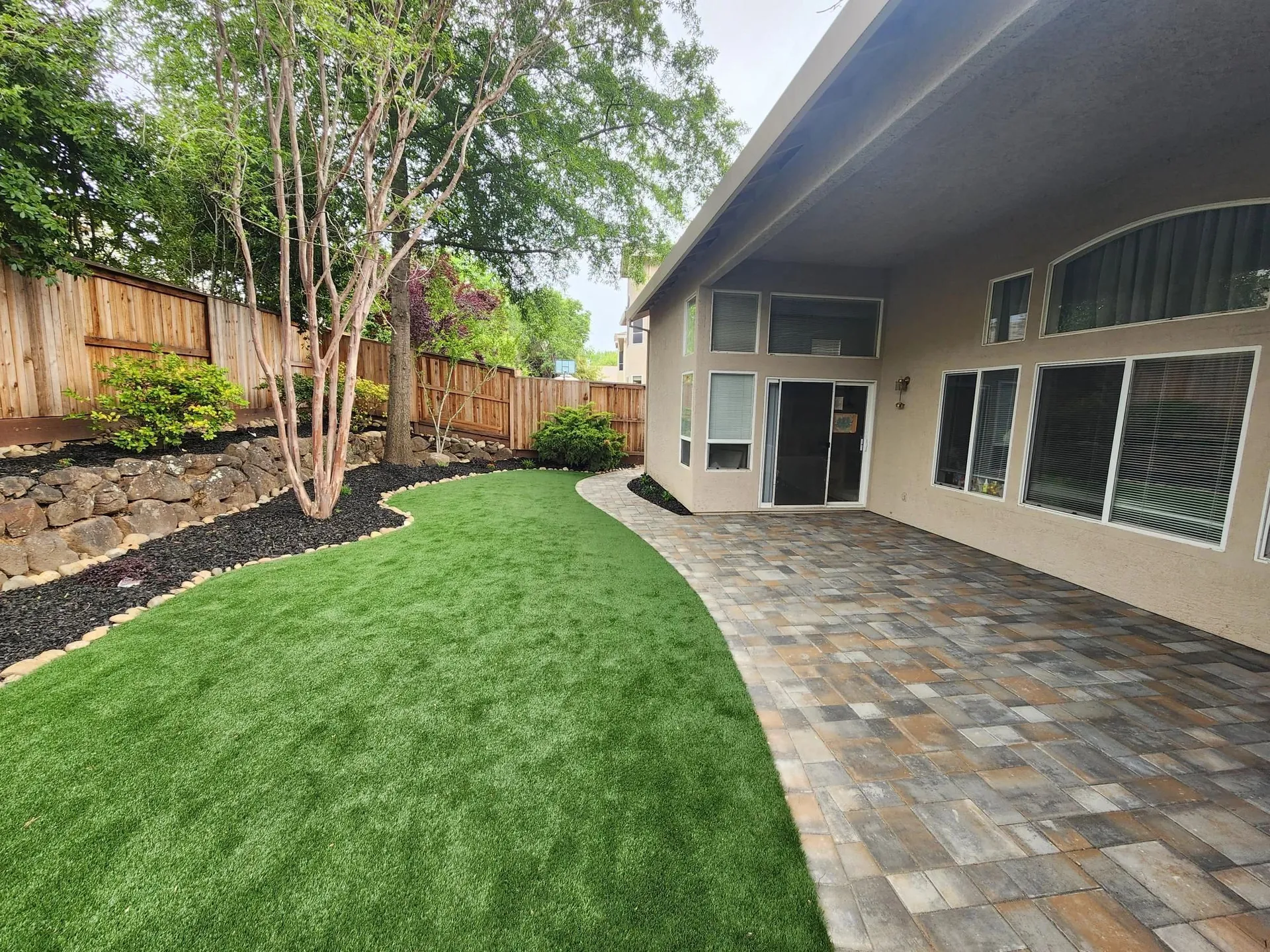 Patio turf and backyard entertainment space photo 2