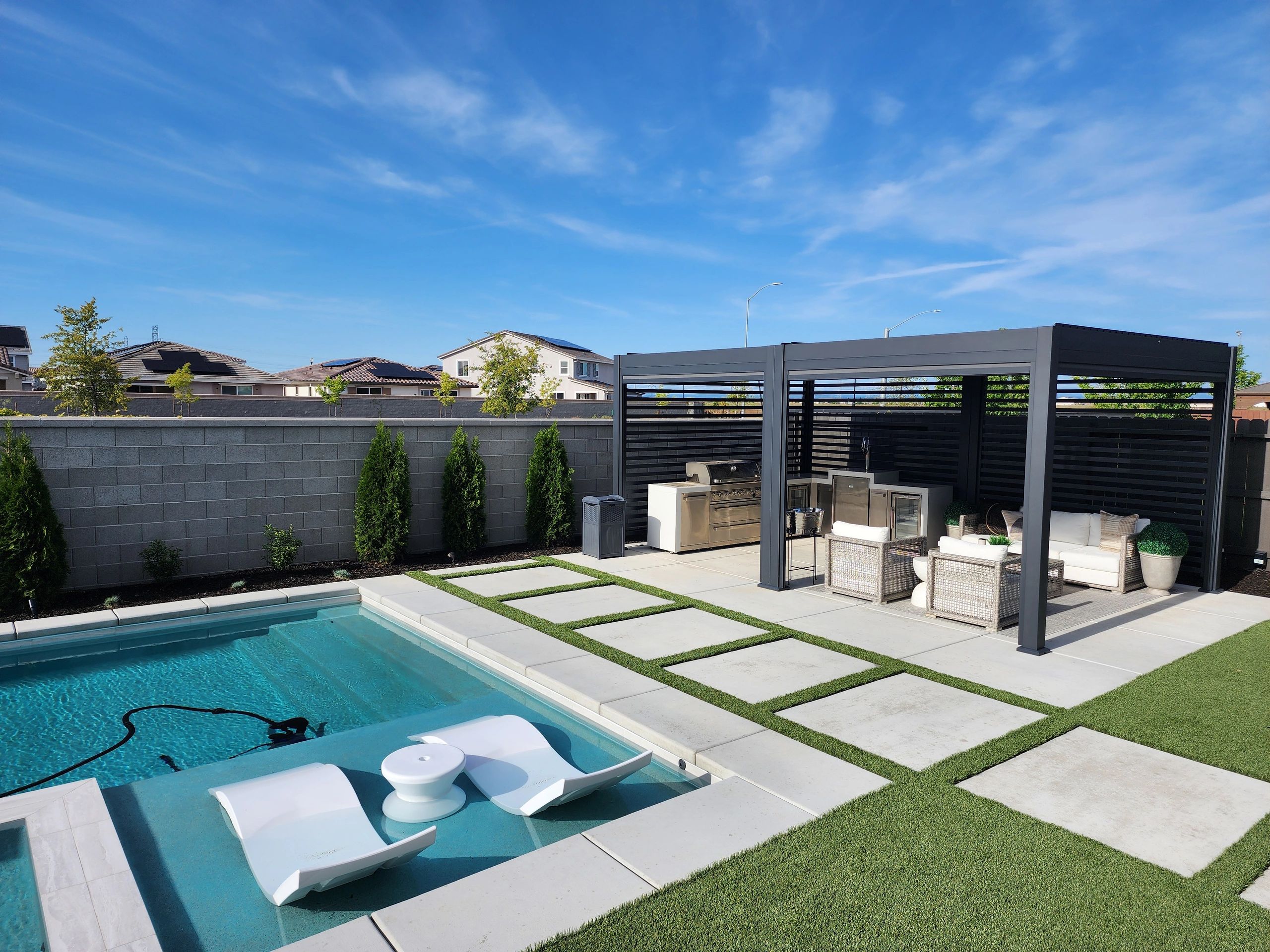 Pool pergola and artificial turf backyard